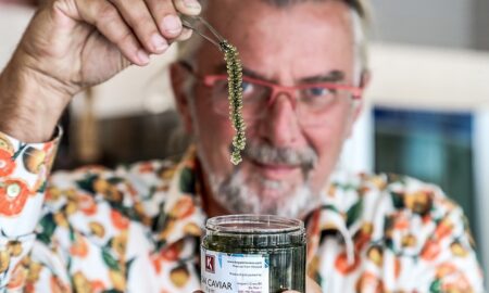 Rob Baan holding Moai Caviar - a light green sea grape looking similar to caviar.