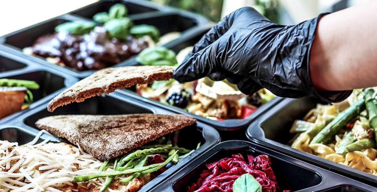 Food to go boxes prepared by a small caterer.