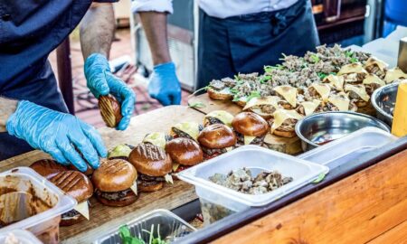 Burger are prepared ob a table