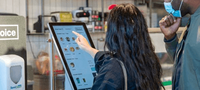 Customers at the digital ordering desk at Choice