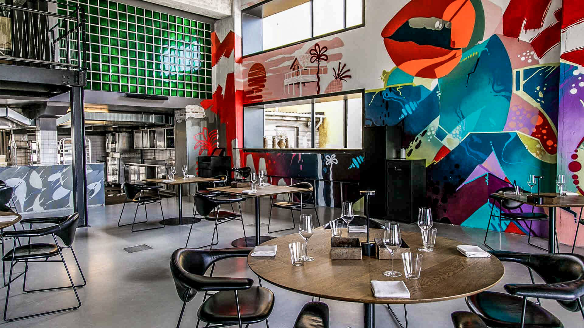 Inside, Amass offers a combination of elevated simplicity, rough concrete and colorful graffiti.
