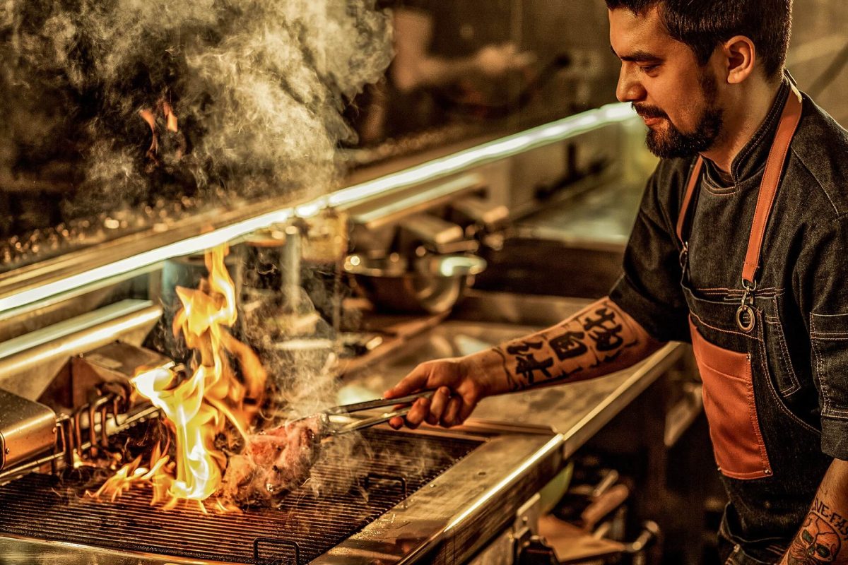 Inspiring chef cooking a steak - a true hero of Hospitality 2021