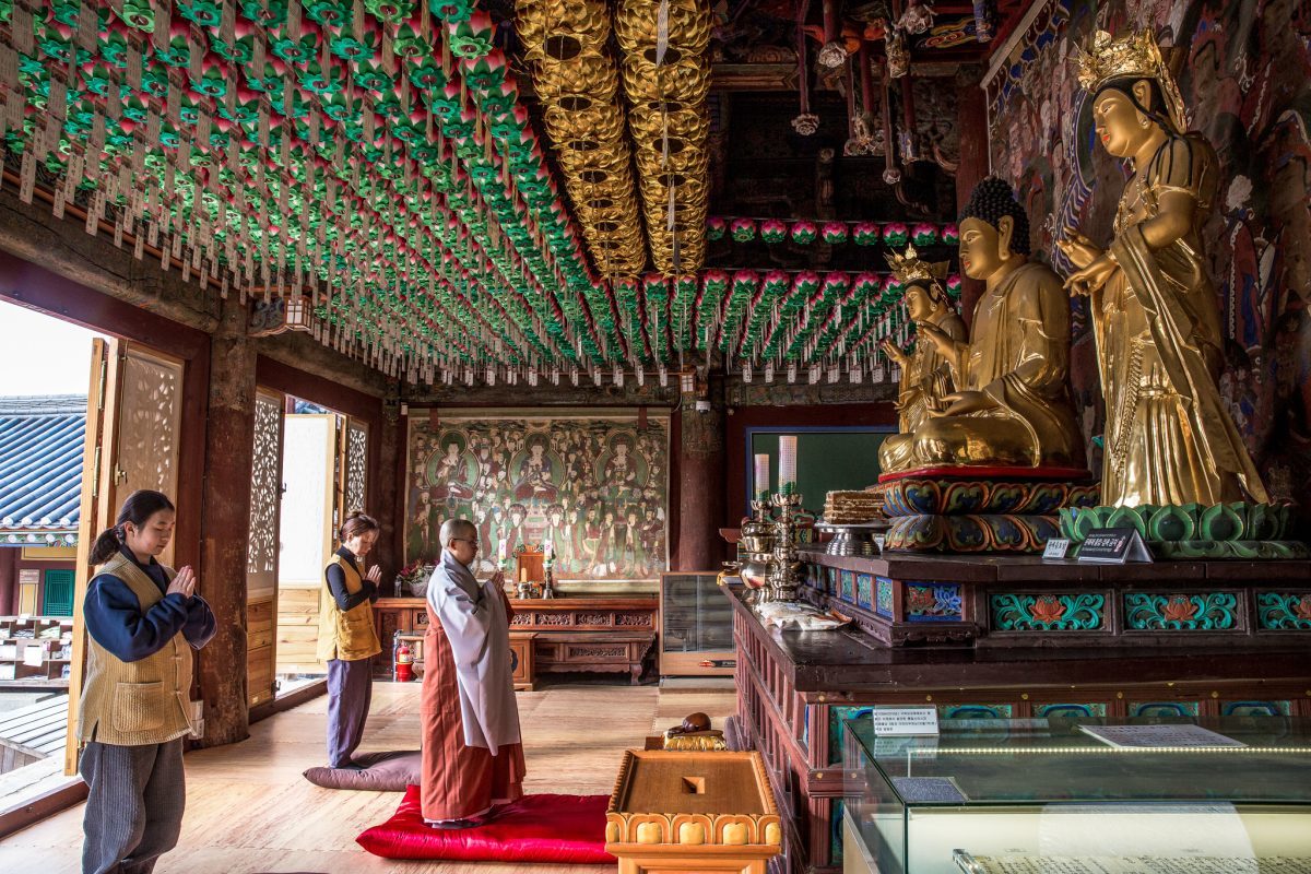 Korean temple with monks giving thanks for food