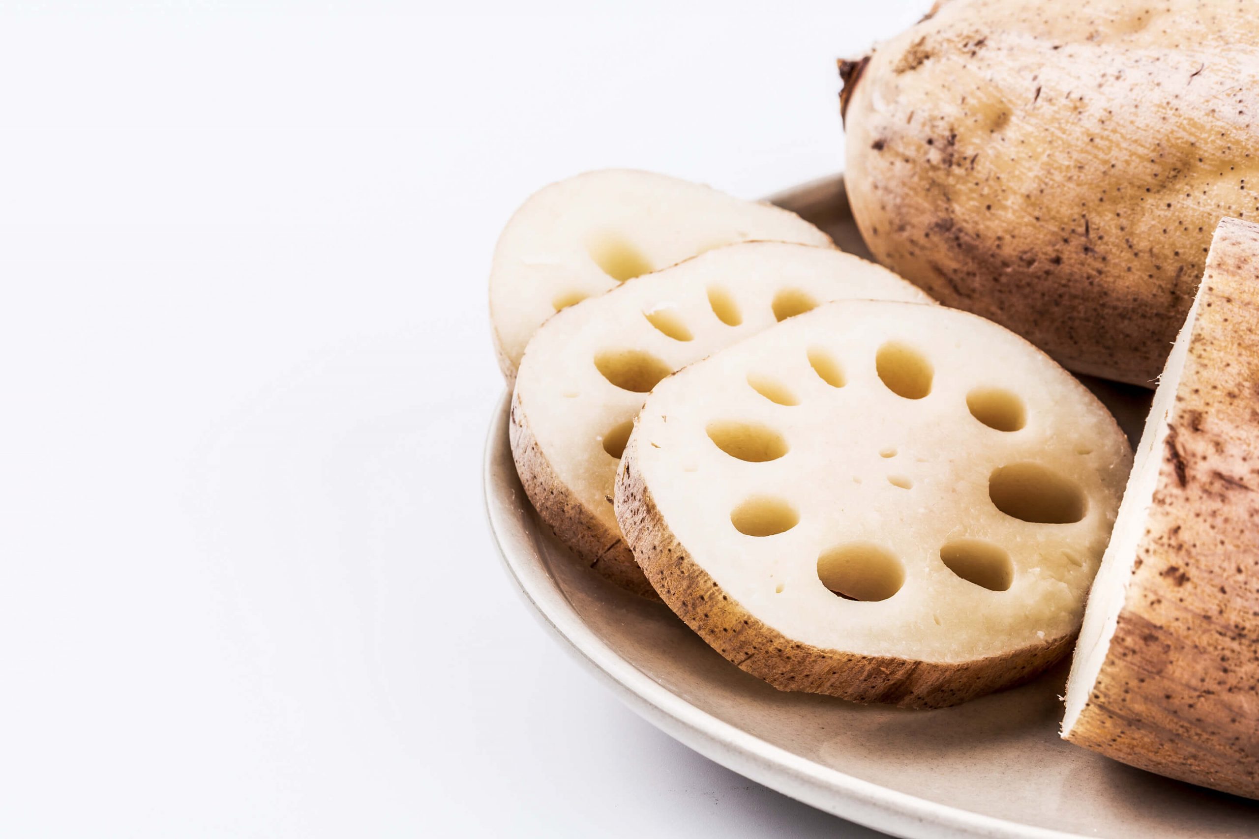 Lotus root thin yellowish discs with pretty hole pattern