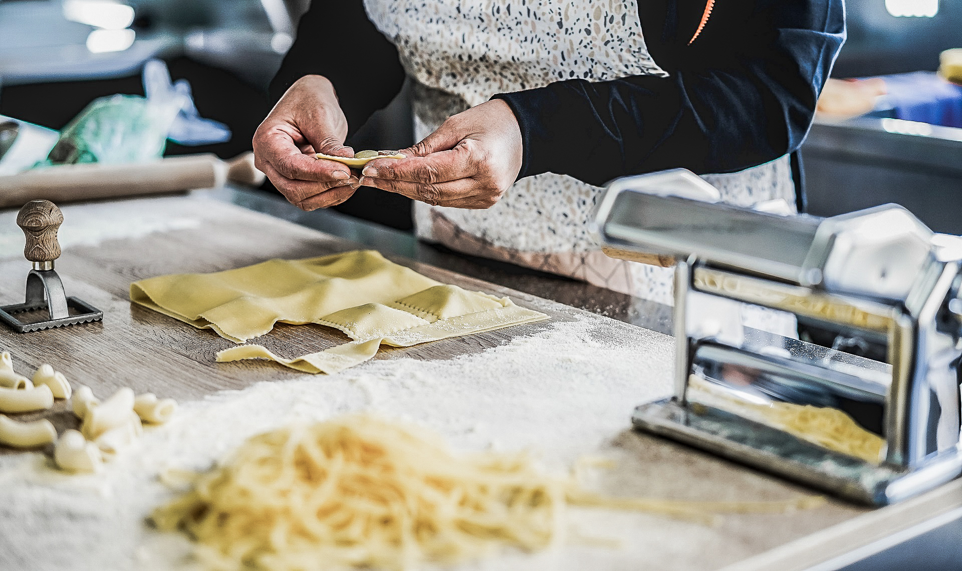 Elderly lady prepares fresh ravioli