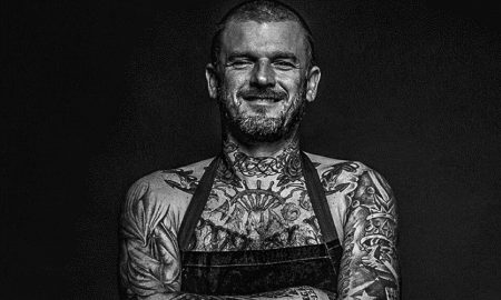 Matt Pritchard smilying cause he loves his job as a vegan chef