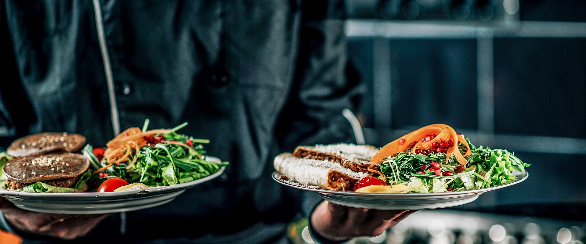 Chef Holding Plate with Organic Vegan Meal