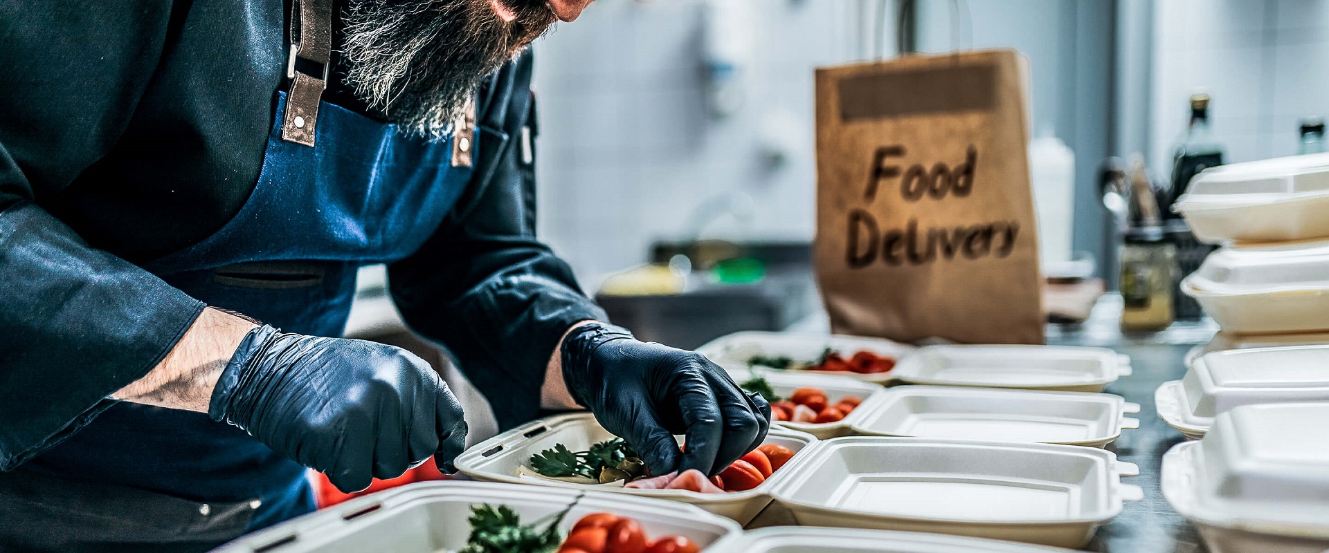 Chef prepares dishes for food delivery 