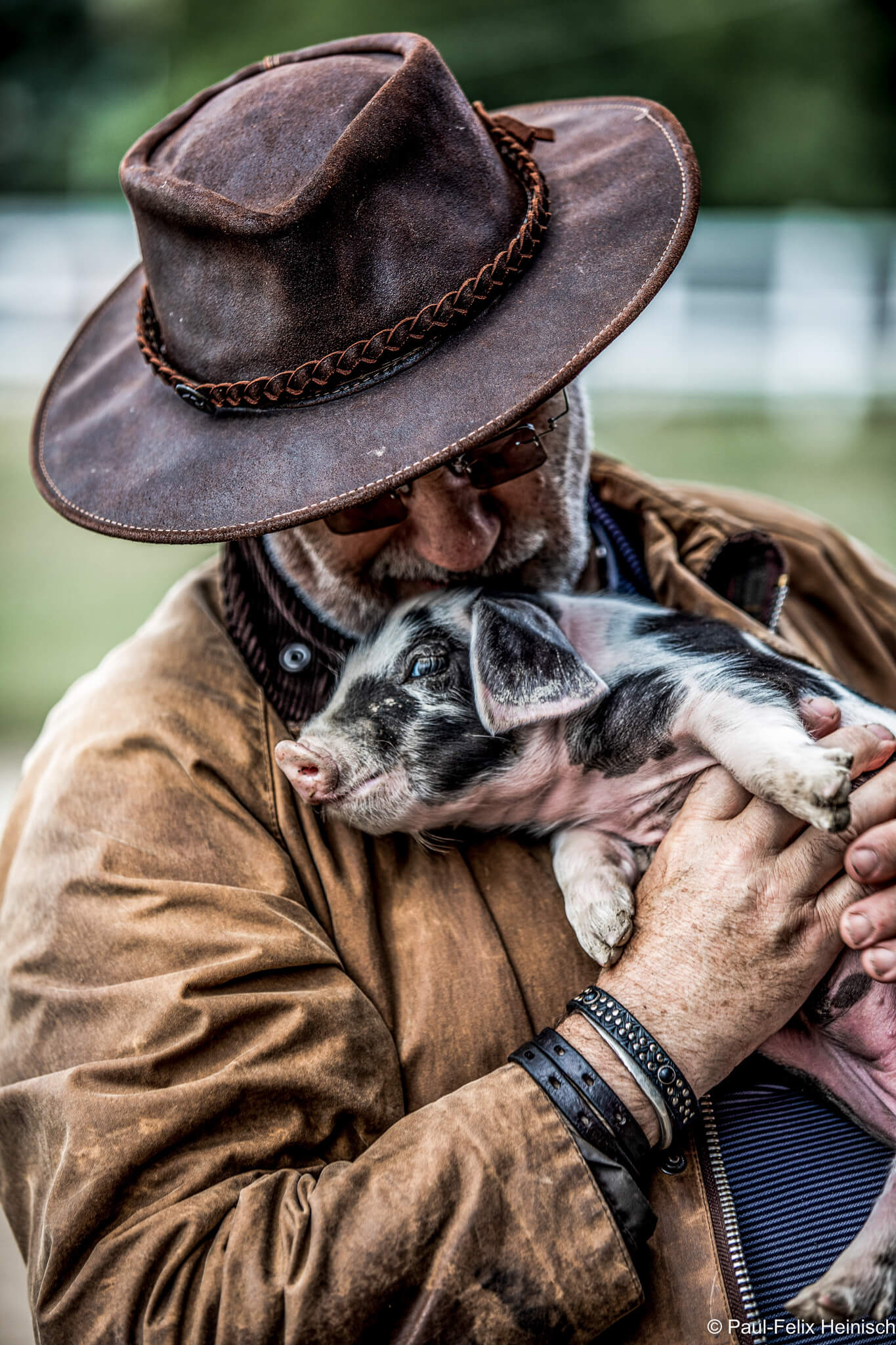 Franz Keller owner of the Falkenhof in the Taunus region with self breeded piglet