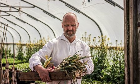 Simon Rogan at Cartmel Farm in a greenhouse