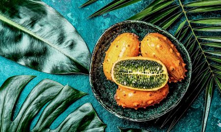 Tropical fruit Kiwano cut open and from mthe outside.