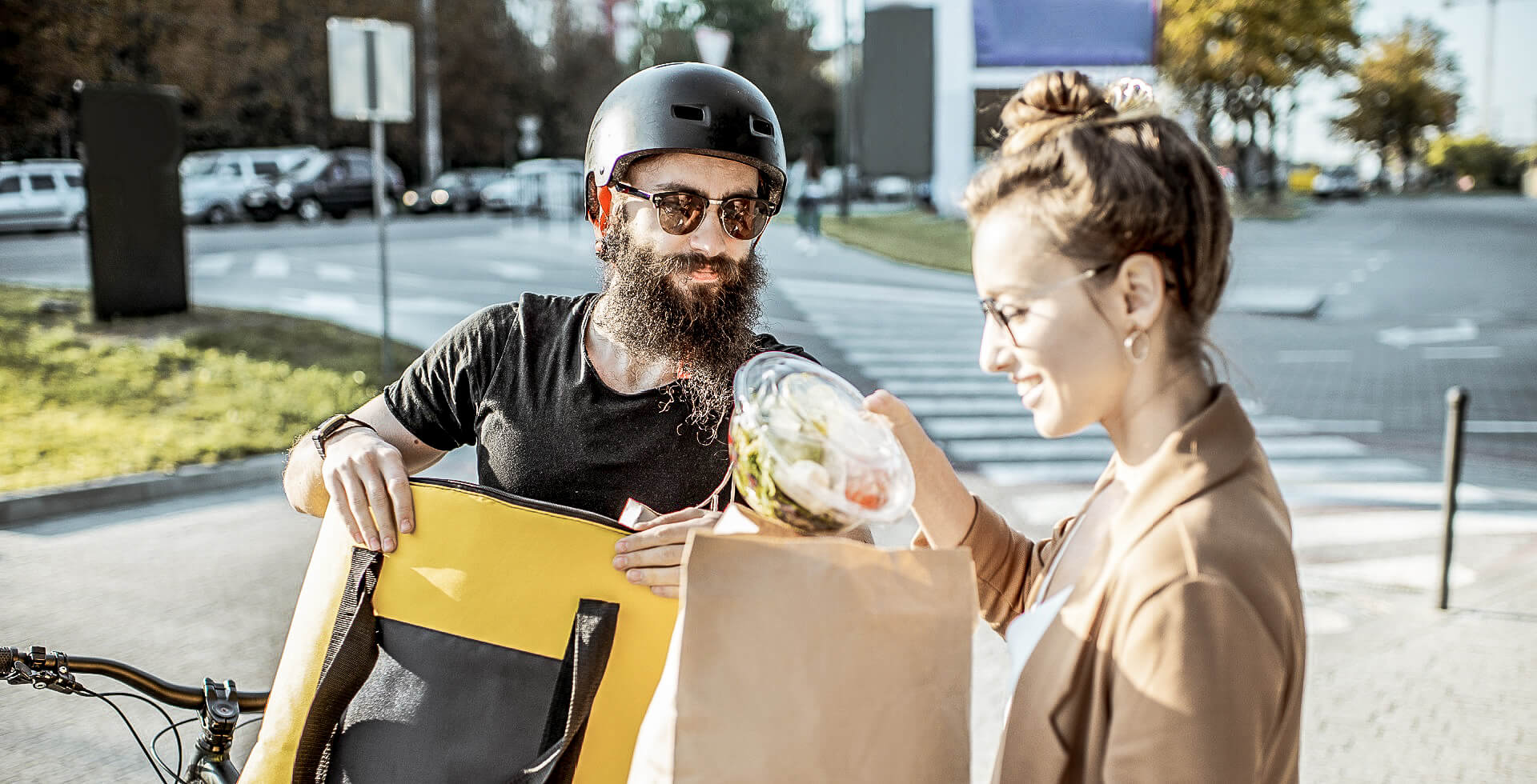 Foodservice Courier delivers food to young business lady