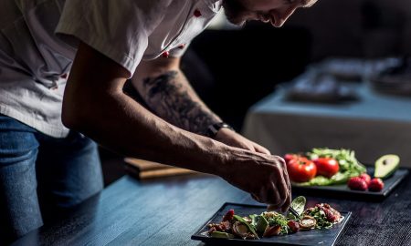 Young chef preparing Michelin-starred menu