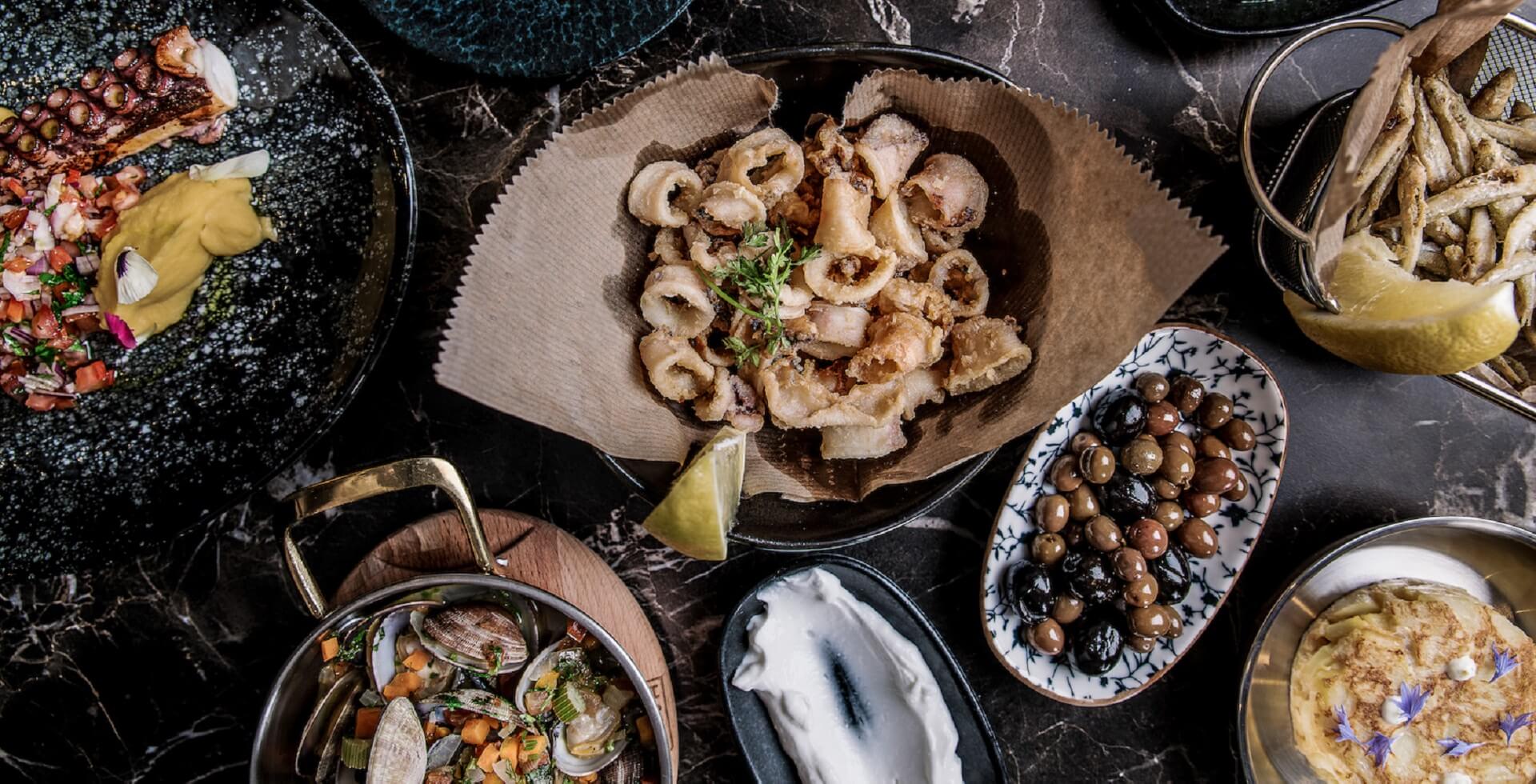 Several dishes on a table in the Restaurant La Paz