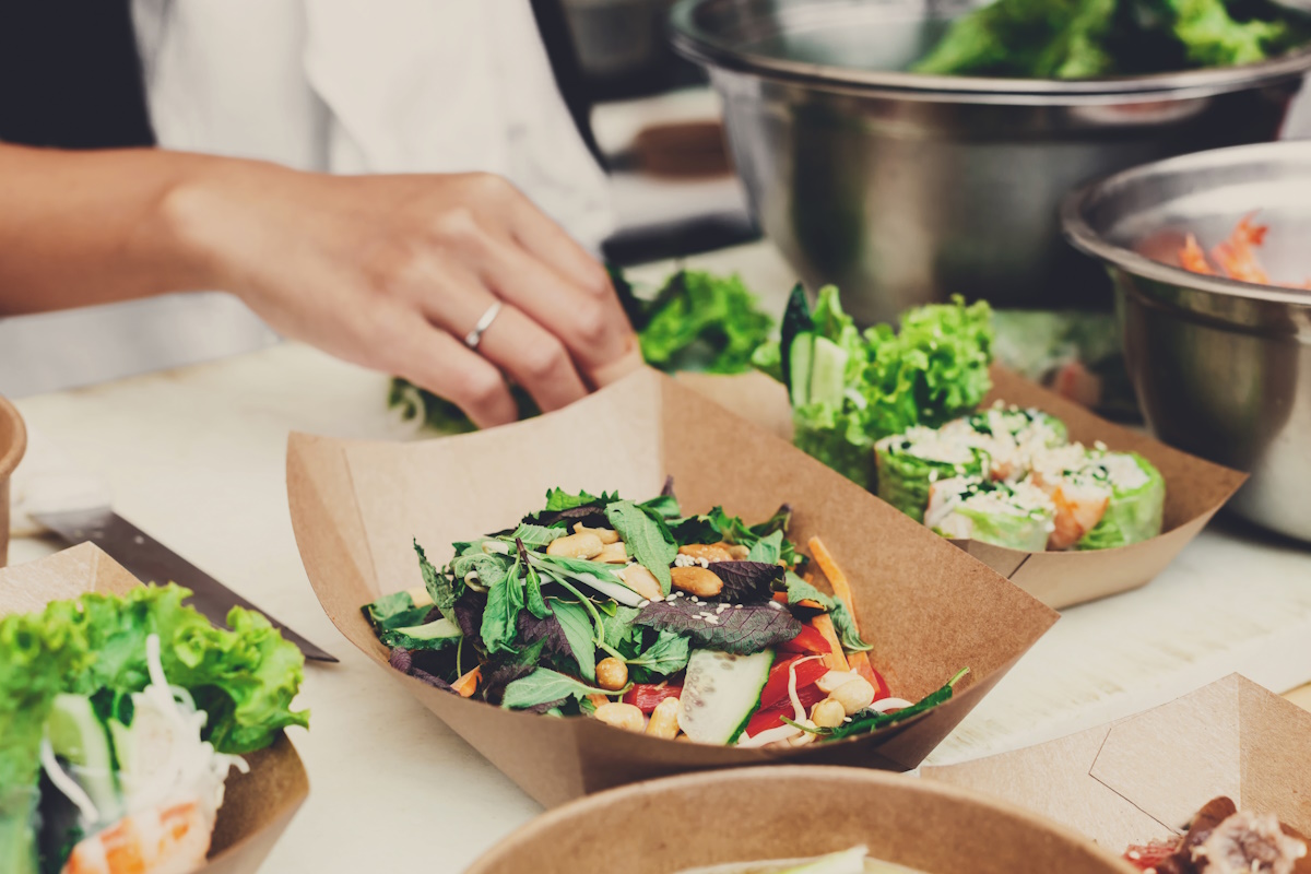 Preparation of various dishes for a catering service.