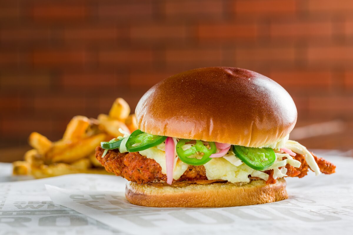 Chicken burger with potatoes in a franchise restaurant