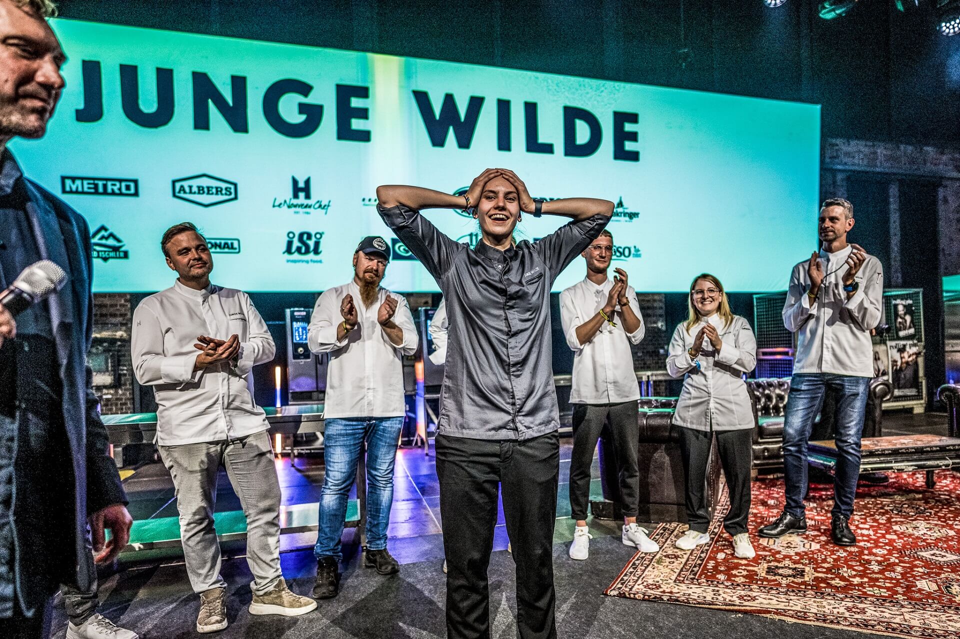 A group of young chefs applaud the winner of the Junge Wilde Award