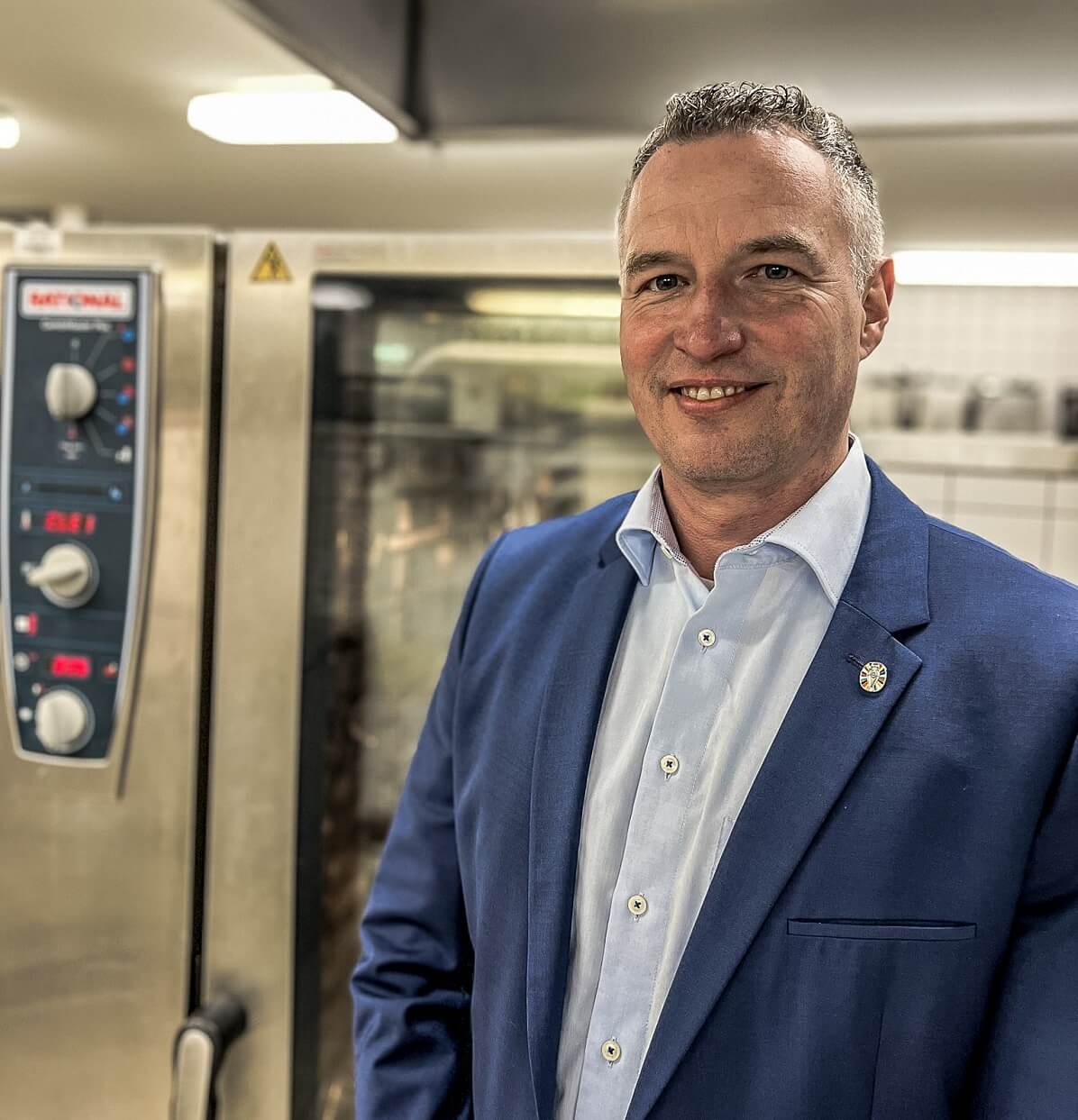 Markus Gollus stands in front of a Rational combi-steamer