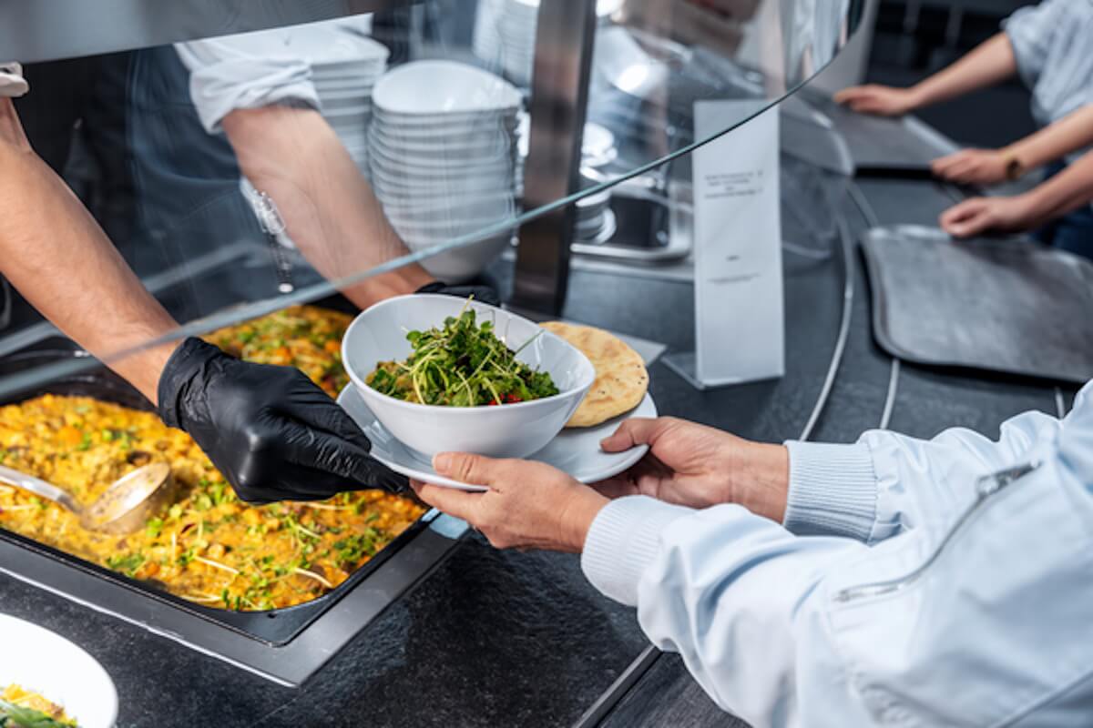 A buffet from which a salad bowl is served
