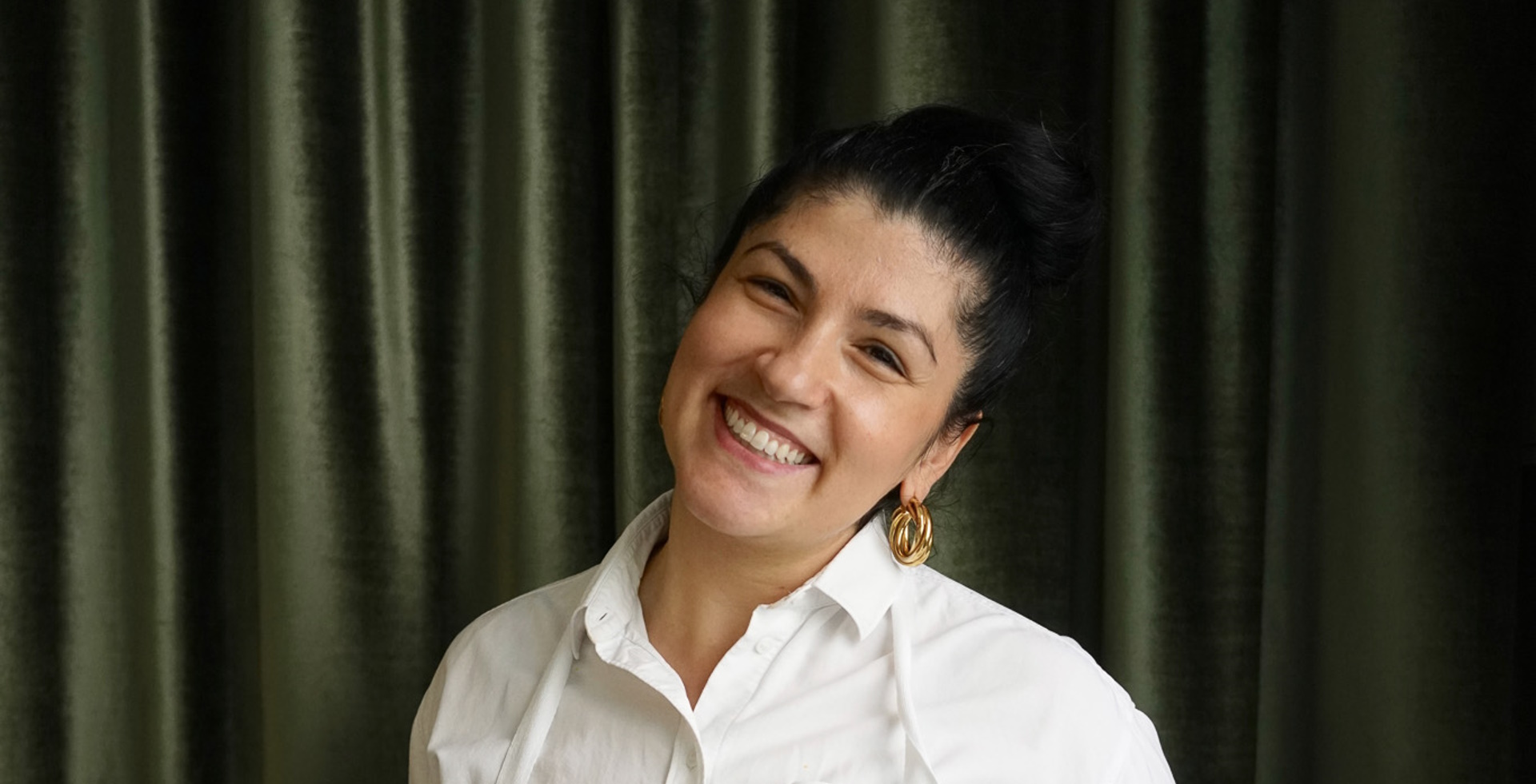 Elif Oskan - Turkish chef in white chef's jacket