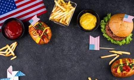 “Typical” American food such as burgers, fries & co. with American flags.