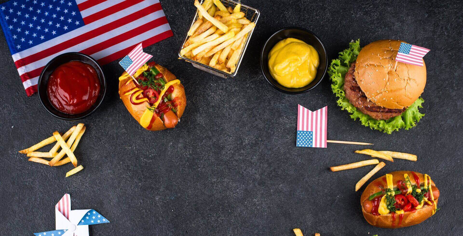 “Typical” American food such as burgers, fries & co. with American flags.